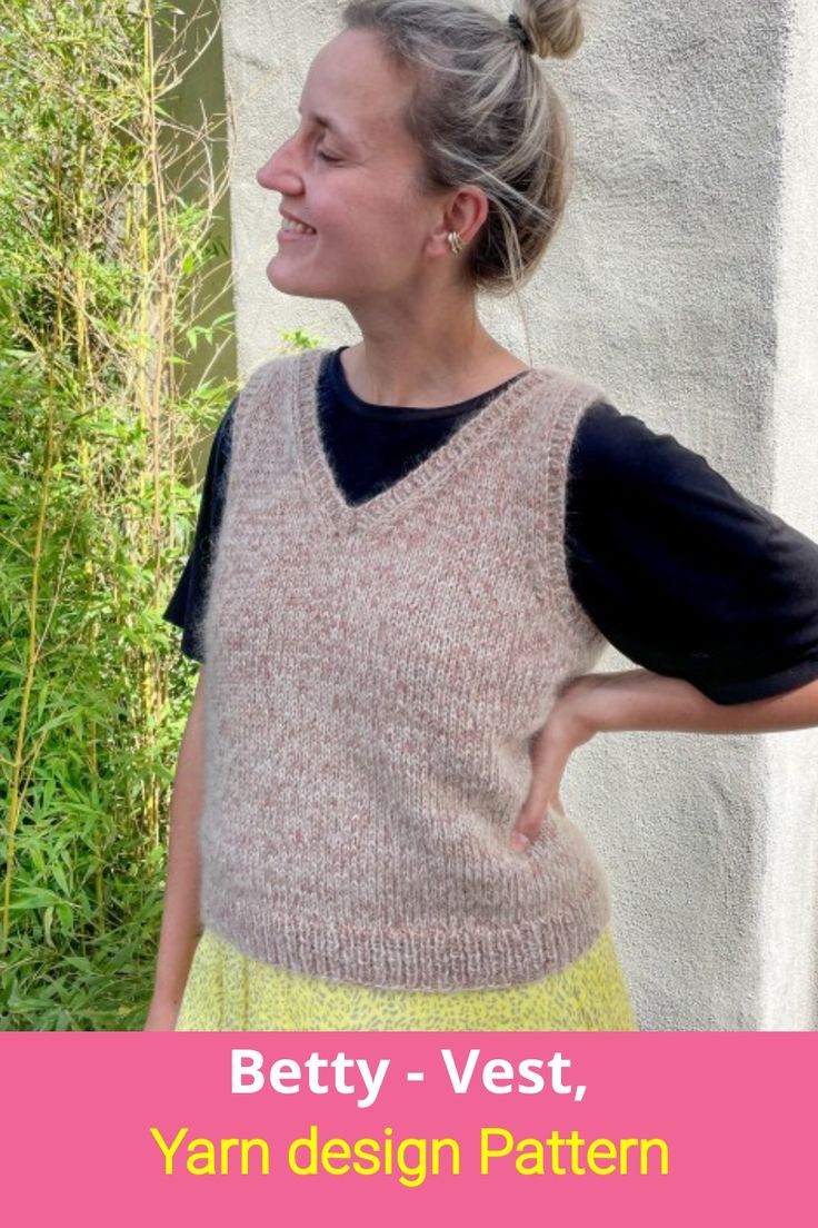 a woman standing in front of a wall with her hands on her hips and the words betty - vest, yarn design pattern