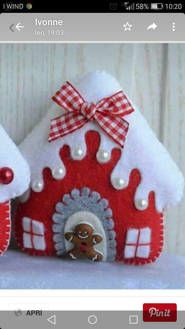 two red and white gingerbread house ornaments