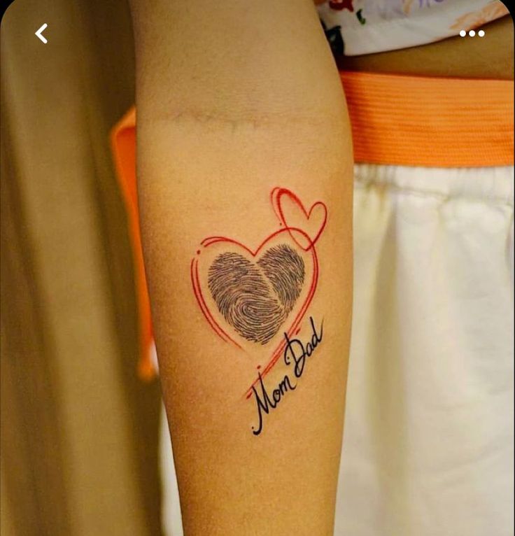 a woman's arm with a tattoo on it that says mom and baby in the center