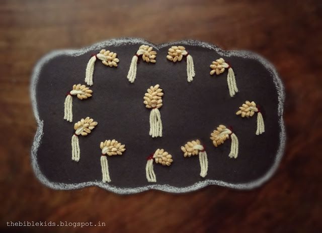 some food is on a black board with white and red trimmings in the shape of flowers