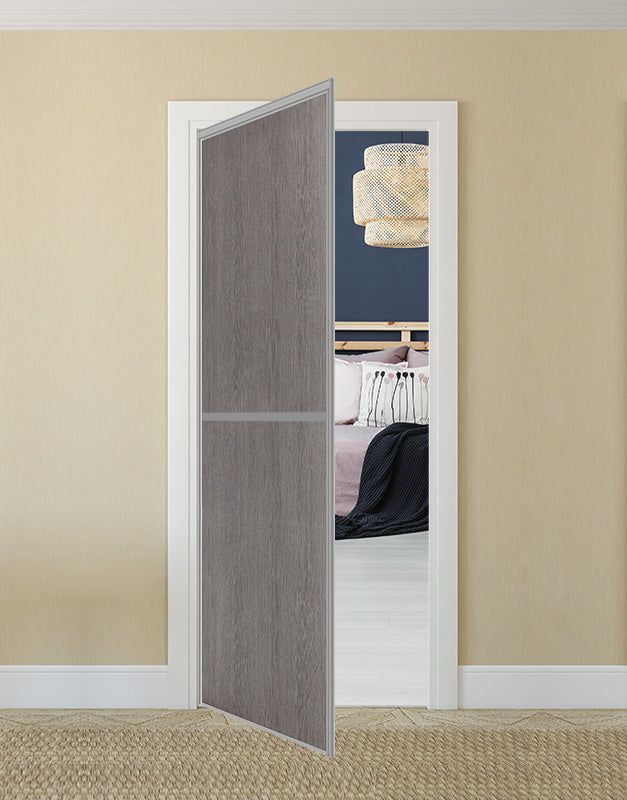 an open door leading to a bedroom with a bed in the background