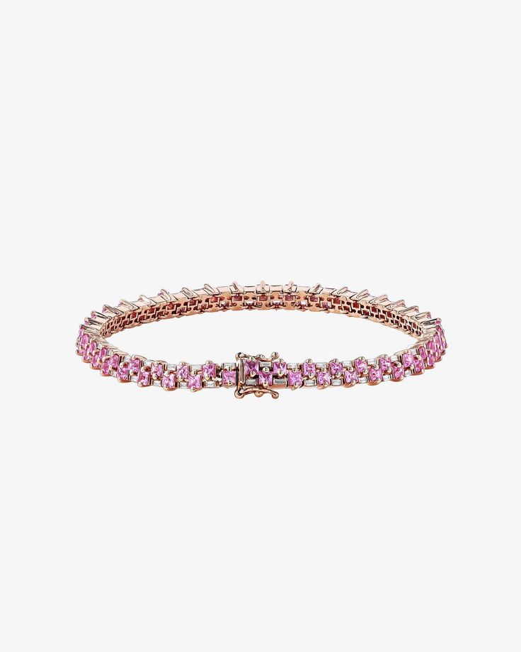 Introducing our Princess Mini Stack Tennis Bracelet, a fusion of elegance and everyday versatility. This bracelet, set with 4.80 carats of 2x2mm princess-cut pink sapphires and 0.95 carats of baguette white diamonds, is a statement of style. Details 18k rose gold 4.80 carats of 2x2mm princess-cut pink sapphires 0.95 carats of white diamond baguettes Bracelet measures 7" inches in length Box clasp with safety lock fastening 4.5mm width Ref: AKB430 Luxury Rose Gold Pink Sapphire Jewelry, Luxury Pink Jewelry With Prong Setting, Classic Pink Tennis Bracelet With Jubilee Design, Classic Pink Tennis Bracelet With Jubilee Style, Pink Jubilee Tennis Bracelet In Classic Style, Luxury Pink Sapphire Bracelets, Formal Pink Diamond Bracelet With 17 Jewels, Luxury Rose Gold Jewelry With Sparkling Stones, Formal Pink Gemstone Tennis Bracelet