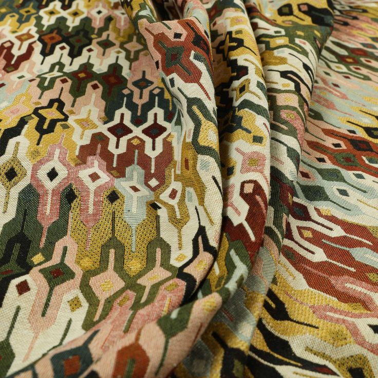 the fabric is multicolored and has an interesting pattern on it's surface