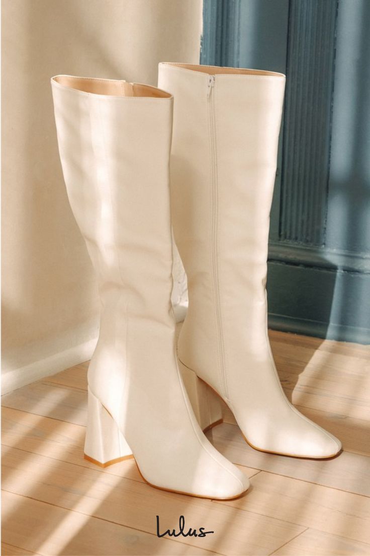 We have a feeling the Lulus Magnolia White Square Toe Knee-High Boots are going to complete all of your go-to looks this season! Smooth faux leather shapes these flirty boots that have a square toe upper and a 14.75"" knee-high shaft with a decorative seam-inspired detail at the outstep and a 15.5"" circumference. A 15.5 zipper at the instep makes for easy styling, while a trendy block heel completes the stylish look! 3. 75" wrapped block heel. Cushioned insole. Rubber sole has nonskid markings. White Boots Aesthetic, Knee High White Boots, White Knee High Boots Outfit, Daphne Halloween, Tall White Boots, White Go Go Boots, White Thigh High Boots, White Heeled Boots, Preppy Boots