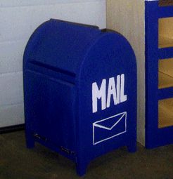 a mailbox with the word mail on it is next to a blue box that says mail