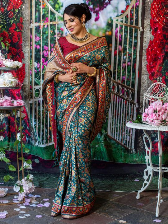 You will be the center of attention in this breathtaking paithani silk saree which comes with intricate reshim and gold weaving. Saree has beautiful flowery designs This beautiful paithani has stitched blouse. Size - 34-42 Color - Royal Green Fabric & Work Style - - Paithani Silk Saree - Embellishments at the border of saree with flowers. Details - - Assured quality. - Wash care instruction: Dry clean only. - Slight variation in color is possible due to digital photography. Navratri Meenakari Tussar Silk Pre-draped Saree, Chanderi Meenakari Pre-draped Saree For Navratri, Bollywood Style Paithani Silk Pre-draped Saree For Puja, Navratri Katan Silk Pre-draped Saree With Meenakari, Traditional Pre-draped Meenakari Saree In Dola Silk, Traditional Pre-draped Saree With Meenakari For Ceremonies, Diwali Meenakari Pre-draped Saree In Dola Silk, Multicolor Paithani Silk Pre-draped Saree For Navratri, Festival Paithani Silk Pre-draped Saree With Cutdana