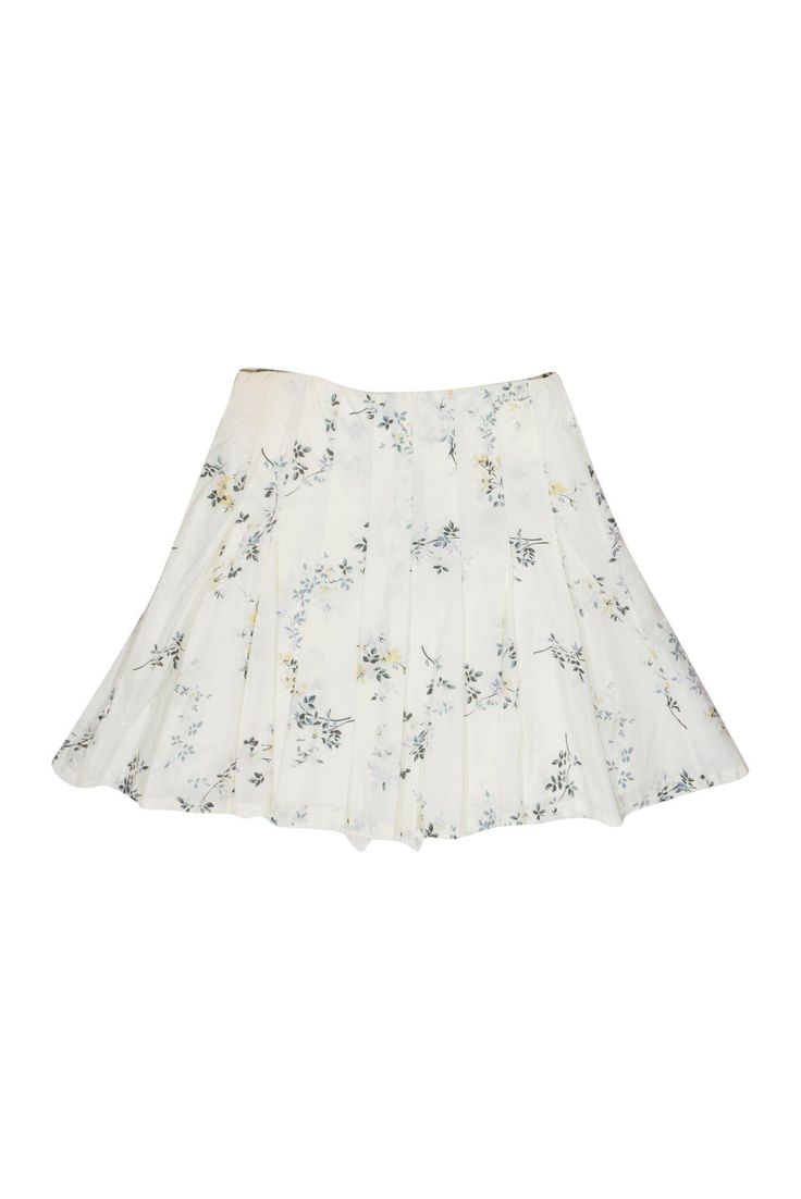 Show off you passion for petals in this adorable skirt from A.P.C.! The floral print and ruffles on this skirt are perfect for a spring outing or even for your Easter outfit! Wear it with a pastel tank and jean jacket for a fresh and flouncy look. Size 6 Shell: 100% Cotton Lining: 100% Viscose Buttons down front Lined Flared skirt w/ pleats Ruffles along front buttons Floral print design Waist 30" Total length 19" Flared Ruffle Skirt For Garden Party, Flared Ruffled Skirt For Garden Party, Ruffled Flared Skirt For Garden Party, White Tiered Skort For Spring, Spring Pleated Tiered Skirt With Ruffles, White Ruffled Skirt For Spring, Chic Floral Print Pleated Skirt For Spring, Spring Ruffled Flared Pleated Skirt, Elegant Spring Skort With Gathered Skirt