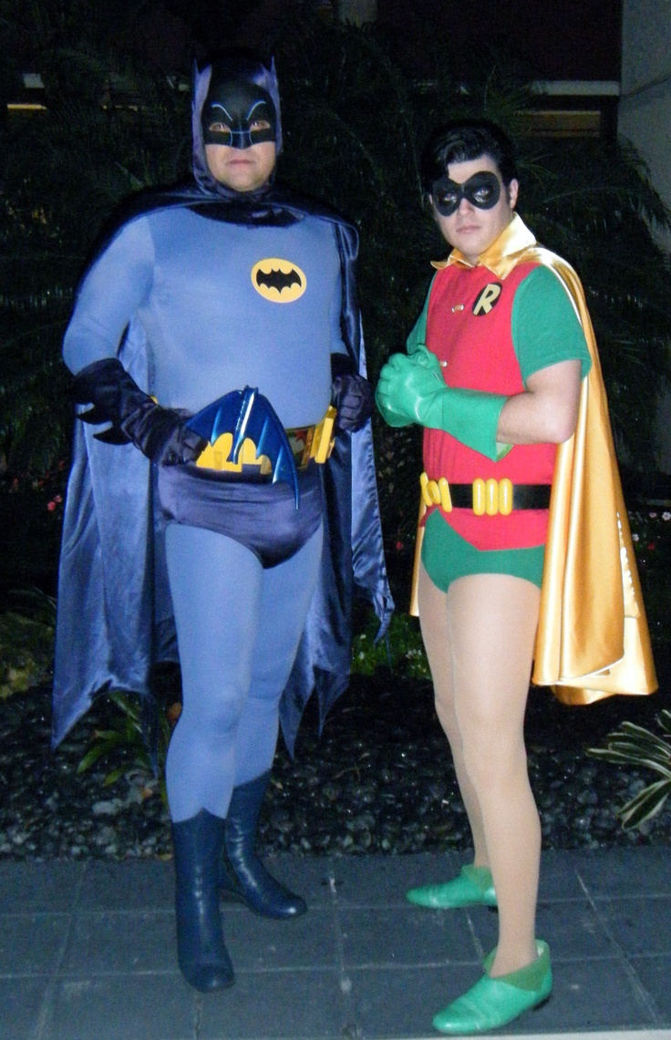 two people dressed up as batman and robin wayne pose for a photo in their costumes