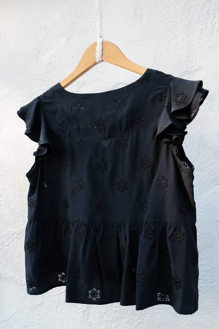 This Lupine Tank is a blousey style that drapes around the waist with a ruffle throughout. Cut from deadstock silk with eyelets sewn throught, with a two-button front. Small ruffles fit around the shoulder. Measurements: X-Small: Bust: 36" Waist: Ruffle opens to 56" Shoulder: 12.25" Length: 18.5" Deadstock silk and shell buttons. Dry Clean to protect our planet's forgotten materials. Party Blouse With Flutter Sleeves And Ruffles, Ruffled Peplum Tops For Work, Ruffled Peplum Top For Workwear, Evening Top With Ruffles And Short Sleeves, Peplum Top With Ruffles For Workwear, Summer Peplum Top With Ruffles For Work, Summer Ruffled Peplum Top For Workwear, Summer Ruffle Peplum Top For Work, Peplum Blouse With Ruffles For Work