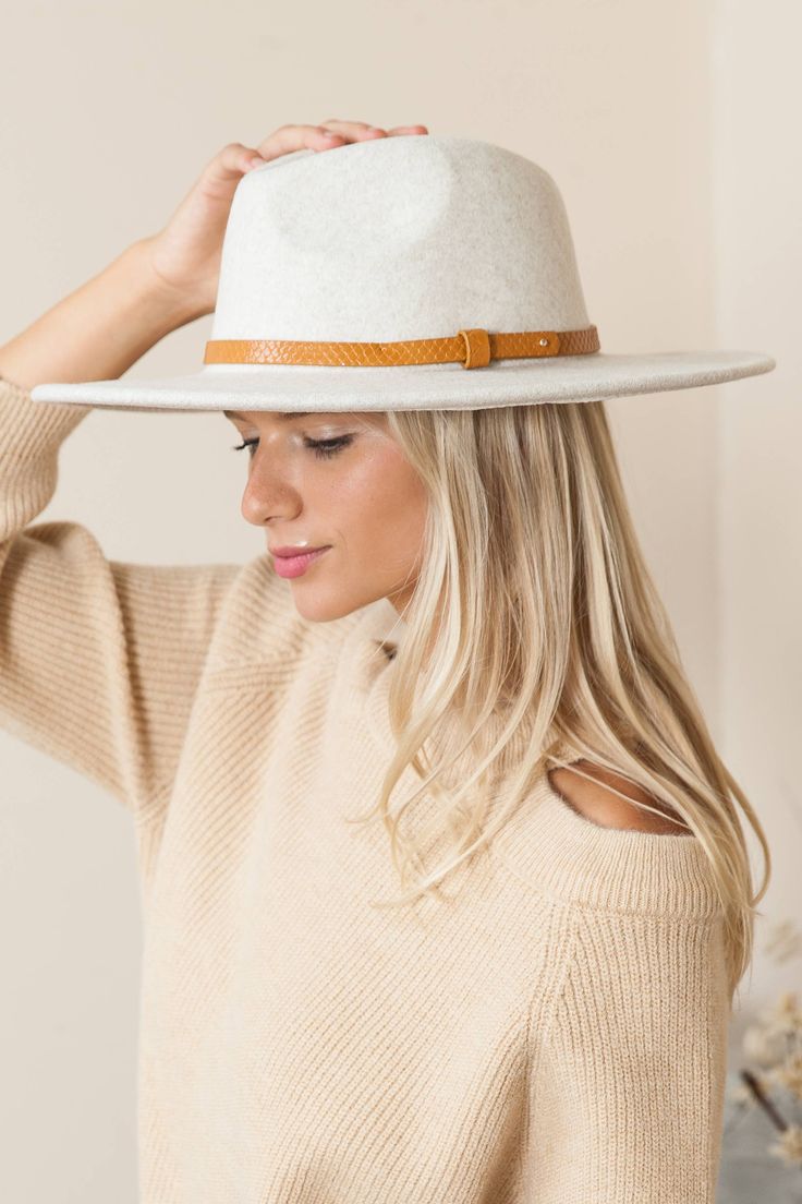 Our Overnight Oats Fedora in Oatmeal is inspired by the classic Americana western films of back in the day (think Audrey Hepburn if she decided to be the cowgirl). It's an absolutely beautiful classy fedora with a neutral color and feminine style. This fedora features a teardrop crown and a faux leather belt. Beige Fedora With Flat Brim For Fall, Beige Flat Brim Fedora For Fall, Classic Beige Panama Hat For Fall, Fitted Beige Fedora With Flat Brim, Beige Fitted Fedora Hat, Fitted Beige Fedora Hat, Western Style Cream Panama Hat, Chic Cream Fitted Fedora, Fitted White Hat Bands For Fall