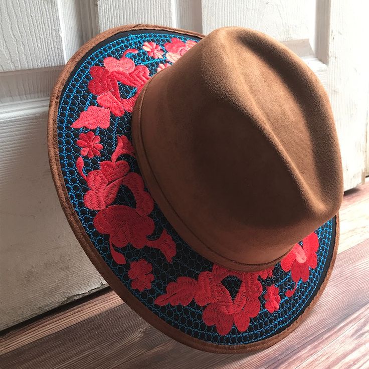 Stand out with this beautiful handcrafted Mexican Suede Hat with beautiful detailed floral embroidered canvas brim. Perfect accessory to add that with that daily outfit. MADE IN MEXICO By: Mexican Artisans For: Women Size: Medium 23' Color: brown | blue | red Details: Top Suede Embroidered canvas brim Inner elastic band Contact us for more details PLEASE READ BEFORE PURCHASE: The picture is an ACCURATE REPRESENTATION.Colors in the pictures may vary a little by effects of light. Each product is h Bohemian Flat Brim Felt Hat For Spring, Bohemian Spring Felt Hat With Flat Brim, Fitted Bohemian Felt Hat For Spring, Traditional Short Brim Hat For Spring, Traditional Wide Brim Hat For Spring, Artisan Hat For Spring, Artisan Spring Hat One Size Fits Most, Embroidered Adjustable Fedora With Short Brim, Bohemian Embroidered Hats One Size Fits Most