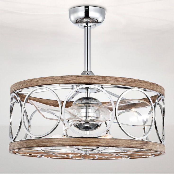 a wooden and glass light fixture hanging from the ceiling