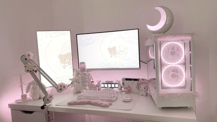 a white desk topped with a computer monitor and keyboard