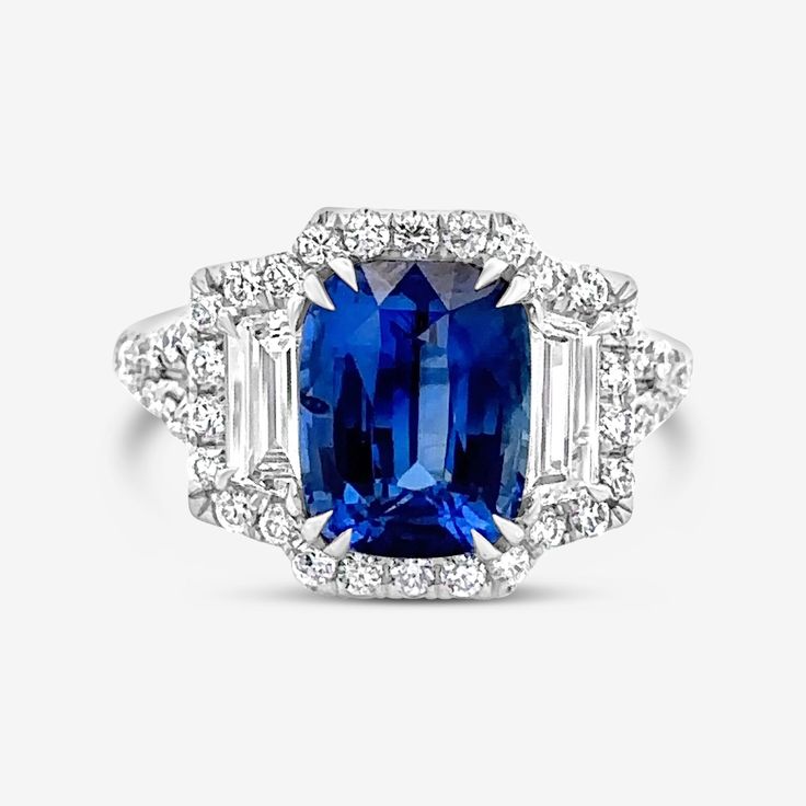 This beautiful gemstone ring is the perfect example of elegance and sophistication. This GIA-certified blue sapphire is adorned with trapezoid and round diamonds set in 18K white gold, creating an extraordinary fine jewelry masterpiece. This piece really pops when paired with other emeralds from our Gemstone Collection. Natural Blue Sapphire: 3.98cts Natural Trapezoid Diamonds: 0.63ctw Natural Round Diamonds: 0.58ctw 18K White Gold Ring Size: 6 GIA Certified Blue Sapphire Diamond Ring, Extraordinary Jewelry, Mens Silver Jewelry, Round Diamond Setting, Golden Ring, Blue Sapphire Diamond, Sapphire Diamond Ring, Handcrafted Rings, Natural Blue Sapphire