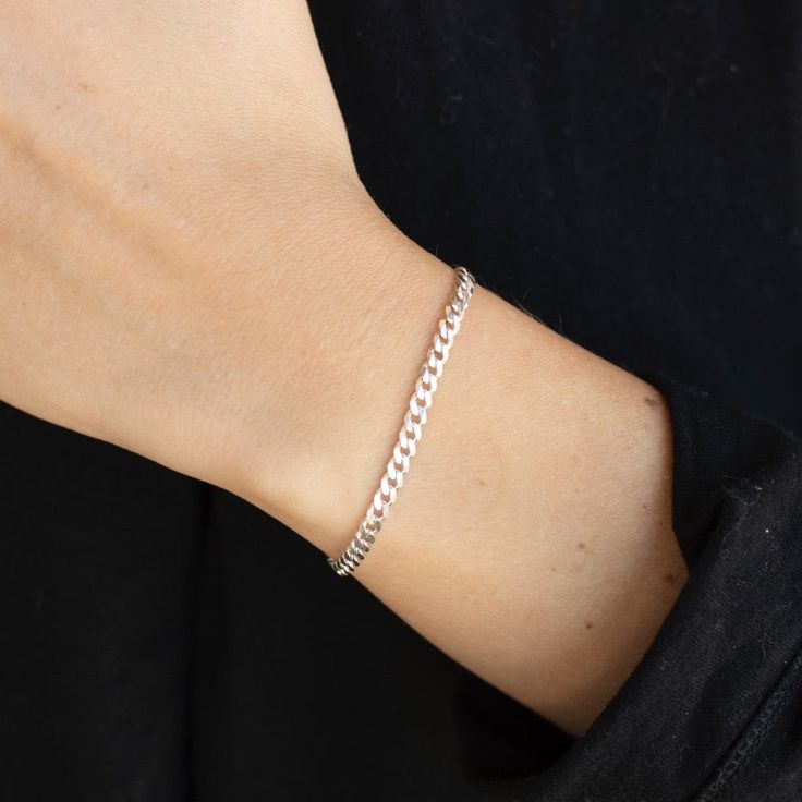 Amp up your accessory game with our Carter Chain Bracelet. This unisex piece features a simple and classic curb style chain, perfect for layering with your favorite accessories. DETAILSAvailable in Sterling SilverHypoallergenic, Nickel Free and Water Safe MEASUREMENTSXS is 5.5" longS is 6" long M is 6.5" longL is 7" long XL is 7.5" long To measure your bracelet size, wrap a piece of string around your wrist the way you would like the bracelet to fit. Then lay the string flat and measure the inch Trendy Link Bracelet With Curb Chain, Trendy Curb Chain Link Bracelet, Adjustable Cuban Link Jewelry For Everyday, Classic Charm Bracelet With Curb Chain For Everyday, Classic Curb Chain Charm Bracelet For Everyday, Everyday Silver Curb Chain Bracelets, Trendy Everyday Curb Chain Bracelets, Trendy Everyday Jewelry With Curb Chain, Classic Adjustable Cuban Link Bracelet For Everyday