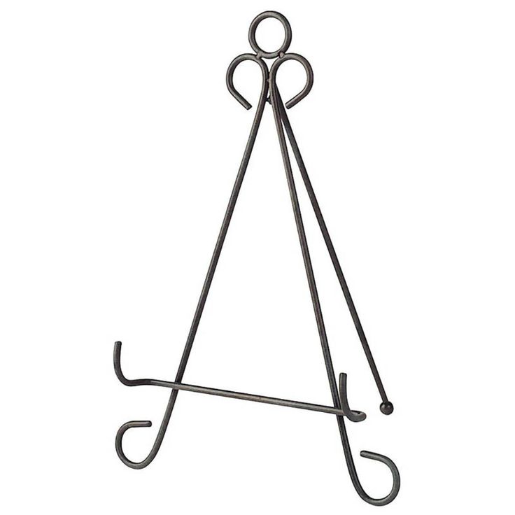 a black metal easel with two handles and an upside down design on the top