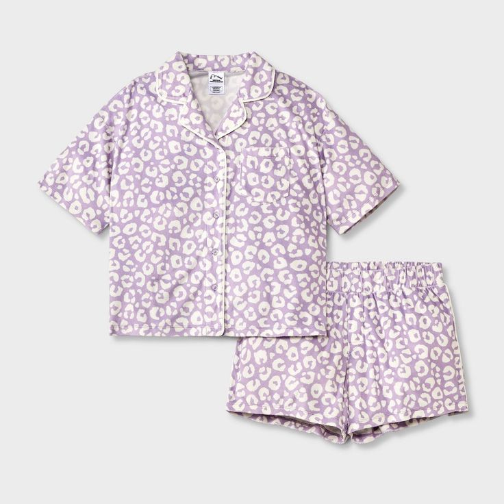 Your kid will hit the hay in cute style with this 2-Piece Short-Sleeve Coat Pajama Set from art class™. This set includes a sleep shirt and shorts, both crafted from recycled polyester knitted fabric for comfortable wear. The short-sleeve button-down shirt features a classic notched collar with a chest patch pocket, while the ruffled hem shorts have a full elastic waistband for a snug fit. Mix and match the set with other PJ separates for a variety of looks. art class™: One-of-a-kind looks for t Short Sleeve Coat, Button Up Pajamas, Leopard Shorts, Purple L, Flannel Pants, Print Coat, Long Sleeves Coats, Pajama Robe, Kids Outfits Girls