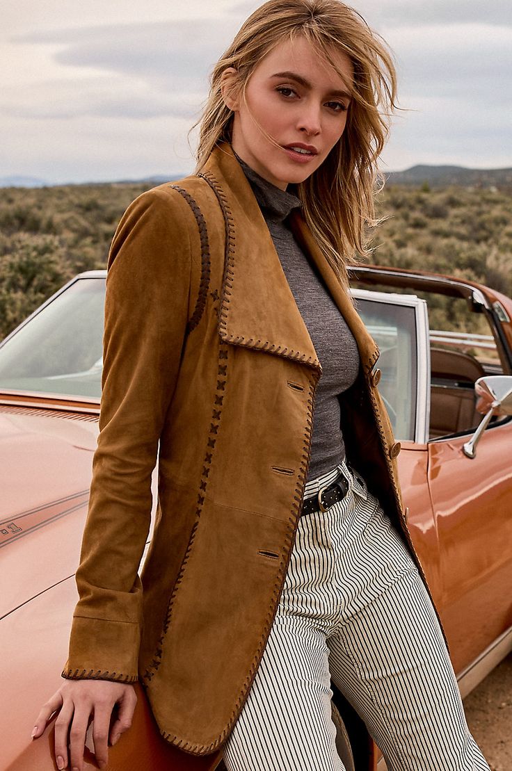 With its sweeping collar and unique whipstitching details, the western-inspired Bailey suede jacket has unforgettable flair. Slip into this casual yet elegant blazer-style jacket, button up the three front corozo buttons, and you'll be ready to take on the day. It's crafted from durable sueded goatskin leather with a wonderfully soft hand, and features contrast-color whipstitching along the edges and front seams for a timelessly rustic look. With two front slip pockets and a soft-tie belt. Elegant Western Outfits, Willow Aesthetic, Dressy Jacket, Capsule Wardrobe Women, Jacket Outfit Women, Elegant Blazers, Suede Leather Jacket, Leather Jacket Style, Blazer Style