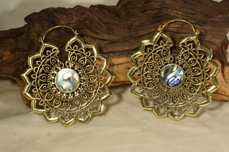 Beautiful pair of earrings with elaborate decorations and mother-of-pearl setting. Available in silver or gold brass. Nickel free. Gold Dangle Jewelry With Artistic Design, Bohemian Metal Hoop Earrings For Wedding, Bohemian Gold Jewelry With Artistic Design, Bohemian Hoop Earrings With Intricate Design For Wedding, Intricate Festival Hoop Earrings, Festival Intricate Hoop Jewelry, Metal Hoop Jewelry For Festivals, Intricate Hoop Jewelry For Festivals, Metal Plug Earrings With Intricate Design