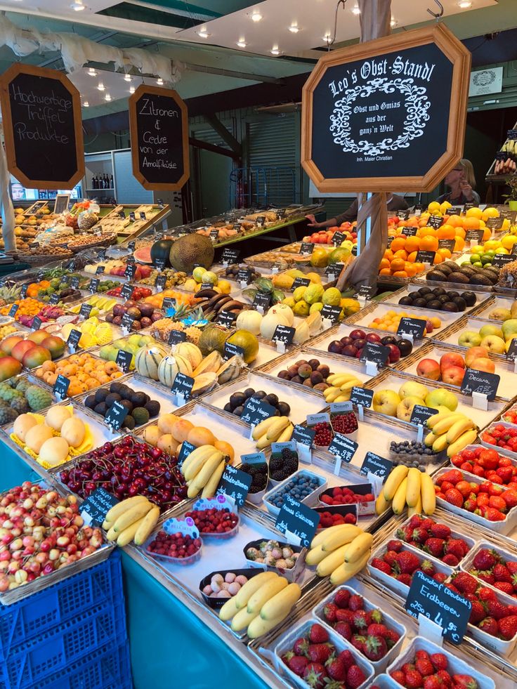 an assortment of fresh fruits on display at a market