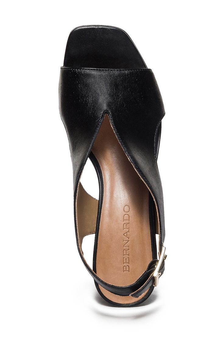 Curvy cutouts and a deep vamp distinguish this leather slingback pump set on a cushioned footbed and lofty block heel. 2" heel Cushioned footbed Leather upper, lining and sole Made in Brazil Modern Leather Slingback Pumps With 4-inch Heel, Black Slingback Sandals With Deep Heel Cup For Evening, Medium Width Slingback Heels With Deep Heel Cup, Leather Slingback Pumps With 4-inch Heel, Leather Slingback Block Heels With 4-inch Heel, Black Leather Slingback Pumps With Deep Heel Cup, Leather Slingback Sandals With Sculpted Heel For Evening, Leather Evening Slingback Pumps With Open Toe, Evening Leather Low Block Heels