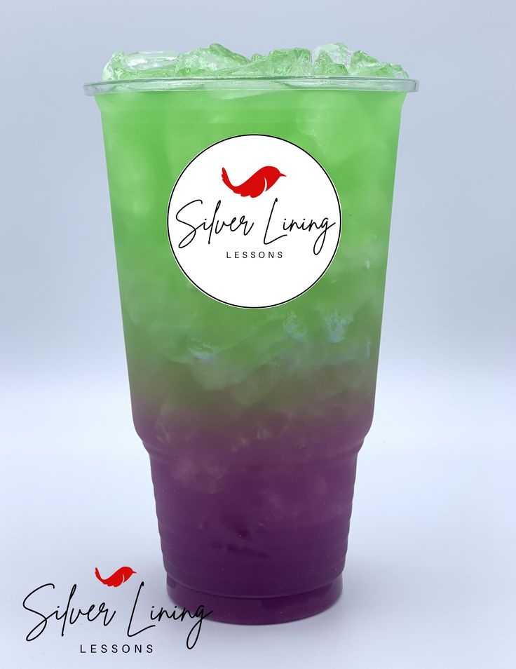 a purple and green drink in a plastic cup on a white background with the words super living lessons