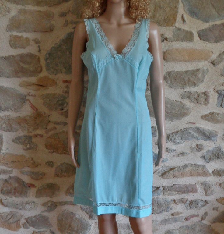 A French vintage dress slip. Made by Eliane this slip is a lovely blue color, I have not seen another in this shade. This underslip is in excellent condition and is a generous size.  Label: Eliane  Size tag: FR 42, GB 14, USA 10 please note this is a vintage item so the fit is a lot smaller. Please check these measurements for fit. Fabric: 100% polyamide (nylon) Measurements: Pit to pit: 19 inches (48.5 cm)  Waist (measured flat): 16.5 inches (42 cm) Hips (measured flat): 19.5 inches (50 cm) Len Blue Sheer Sleep Dresses, Sheer Blue Sleep Dresses, Blue Sheer Daywear Dresses, Blue Sheer Dress For Daywear, Blue Fitted Slip Dress For Sleep, Blue Slip Dress For Daywear, Blue Sheer Sleeveless Nightgown, Blue Sleeveless Slip Dress For Sleep, Light Blue Sheer Dress For Daywear