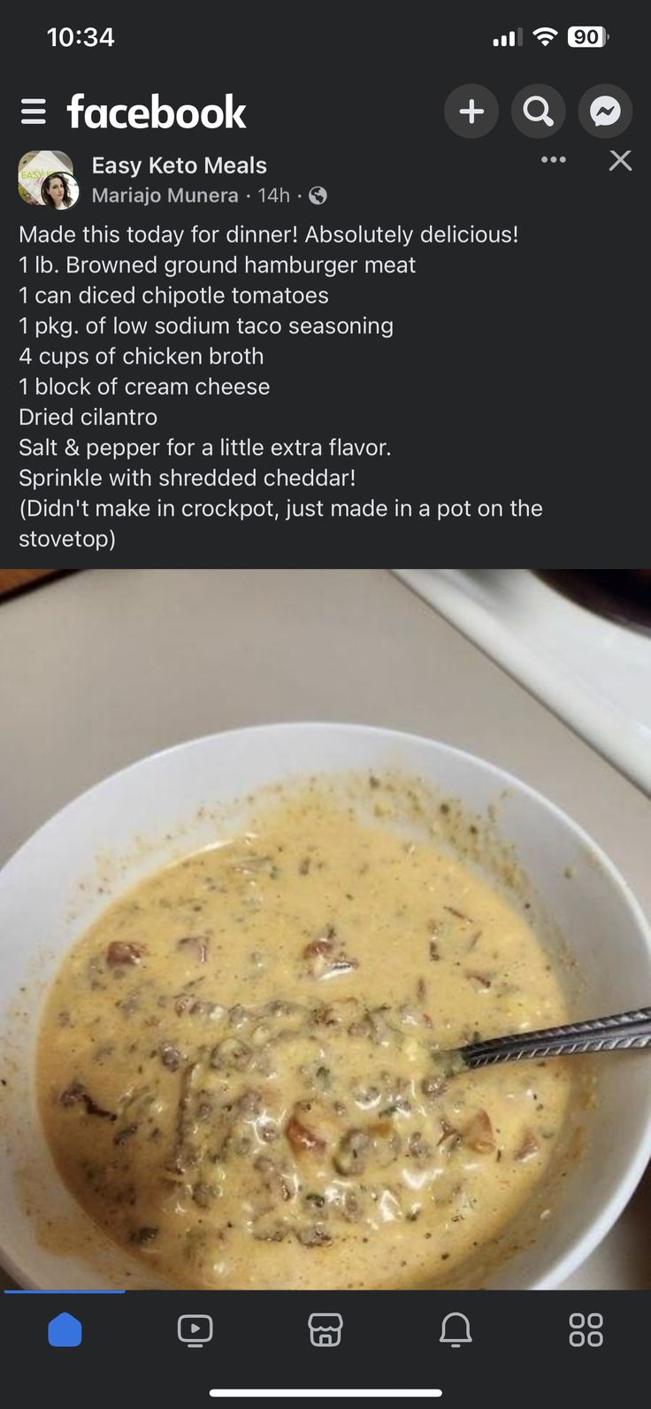 a white bowl filled with soup on top of a table