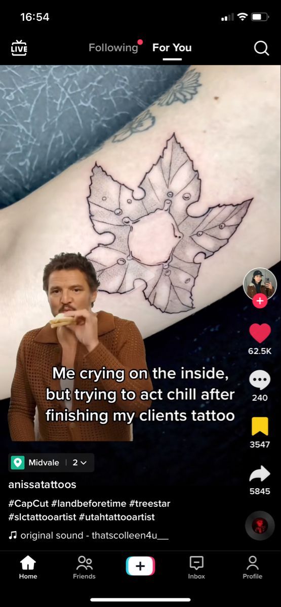 the tattoo is being displayed on an iphone