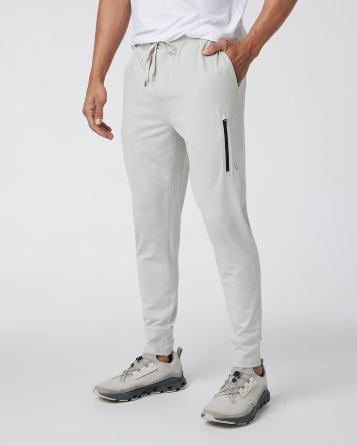 A fresh take on athleisure and a staple in your wardrobe. The Sunday Performance Joggers are made from premium recycled performance stretch fabric. The shorter inseam will keep you moving with less bulk around your ankles; these joggers offer equal parts of style and comfort. | Vuori Sunday Performance Jogger Pants | Vapor Heather | Medium Vuori makes premium performance apparel inspired by the active Coastal California lifestyle; an integration of fitness, surf, sport, and art. Breaking down th Athleisure Activewear With Tapered Leg And Side Pockets, Relaxed Fit Athleisure Bottoms In Recycled Polyester, Athleisure Bottoms In Recycled Polyester With Relaxed Fit, Sporty Relaxed Fit Pants In Recycled Polyester, Versatile Running Bottoms In Recycled Polyester, Athleisure Activewear With Side Pockets In Recycled Polyester, Sporty Bottoms With Side Pockets In Recycled Polyester, Sporty Jogging Bottoms In Recycled Polyester, Casual Running Pants With Pockets