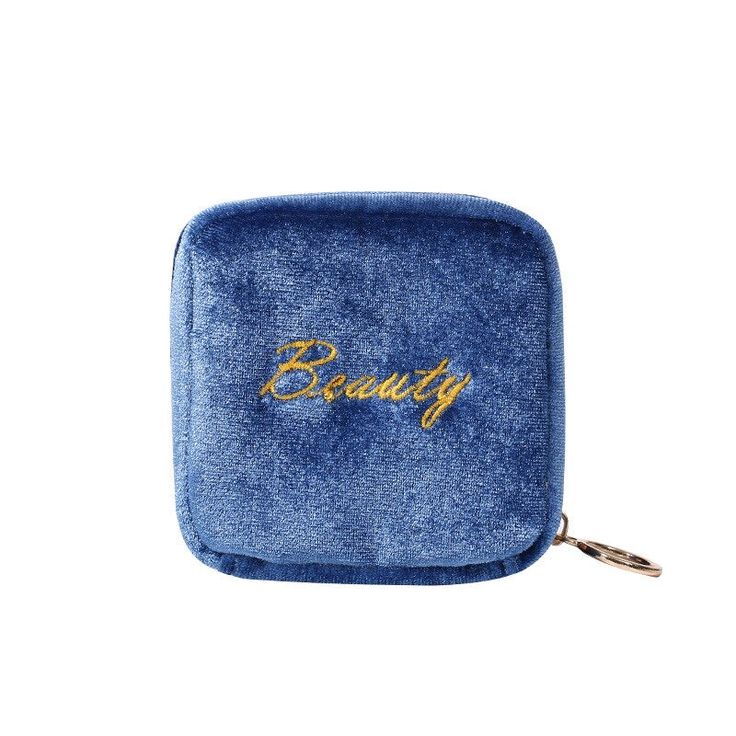 a blue velvet case with the word beauty on it