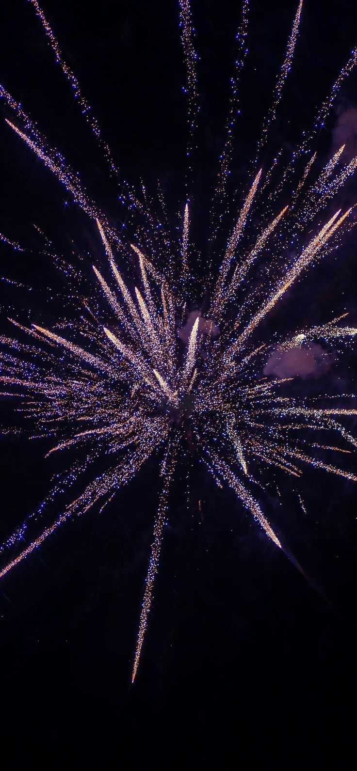 fireworks are lit up in the night sky with bright colors and sparkles on them