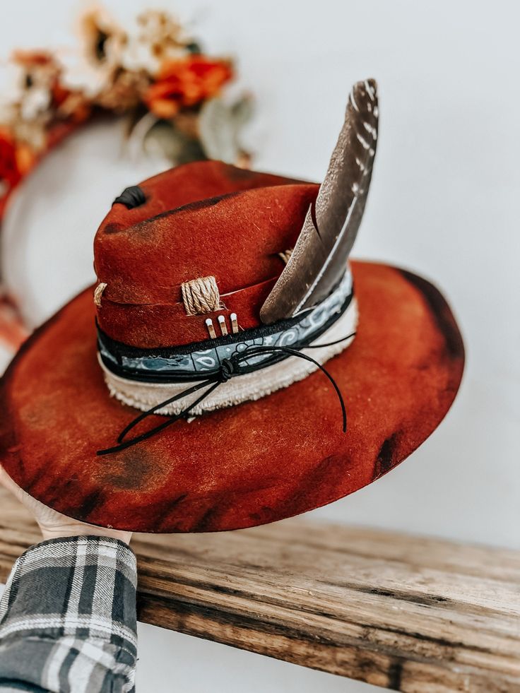 This burnt, distressed, felt Fedora hat is a size One Size Fits All (57 cm around). You can always purchase hat tape and place it between the band and the hat underneath so you can't see it if it's too big. The hat band is a genuine black jean, bandana, leather, and linen band with a feather and matches accent. This hat is burnt so it might have a slight smell for a few weeks. All feathers are glued to hold on the hat. FREE SHIPPING ON ALL OUR HAT ORDERS! All hats are branded by ©The Kiersten Zi Boho Hats, Distressed Hat, Boho Hat, Felt Fedora, Black Jean, Vintage Hat, Vintage Velvet, Hat Band, Fedora Hat