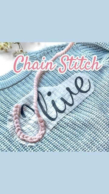 the chain stitch live logo is shown on a blue shirt with pink beads and a white bea