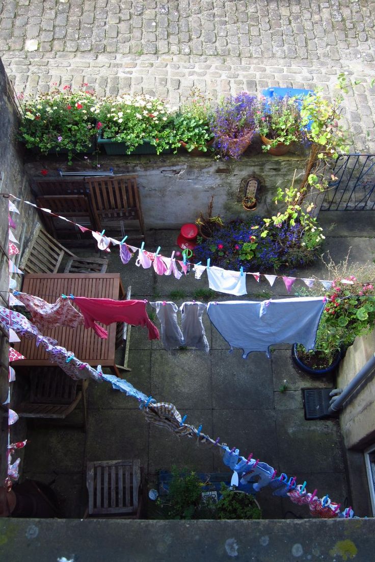 an overhead view of a patio with clothes hanging out to dry on the clothesline