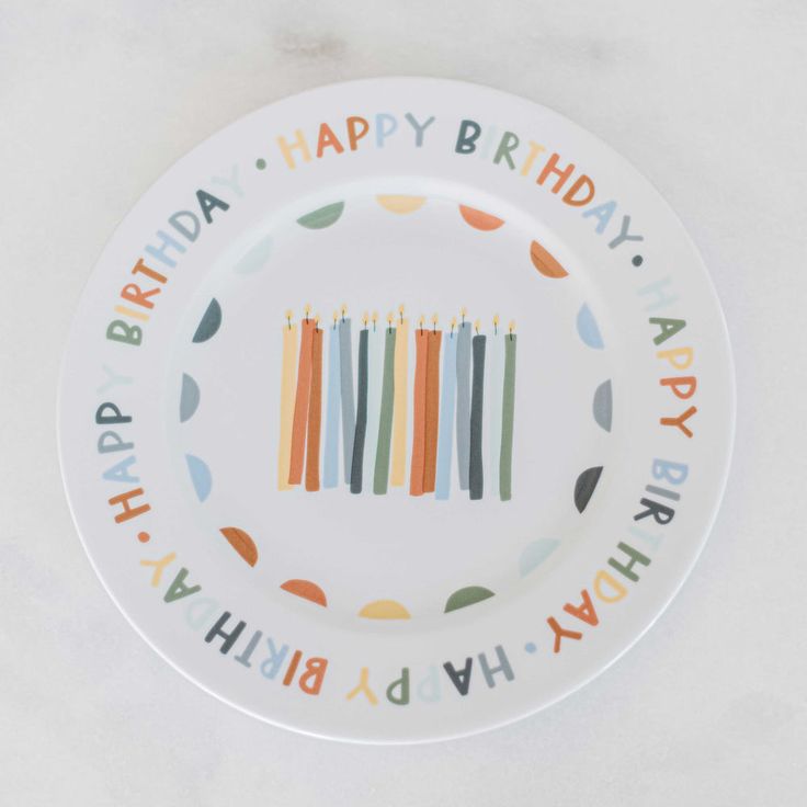 a birthday plate with candles on it that says happy birthday