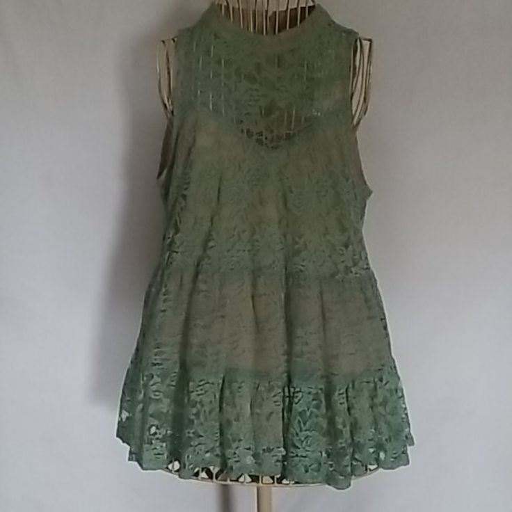 Sleeveless Fully Lined Top That Is Seashell Green Colored. Button In The Back With Peek A Boo Outlet. Totally Beautiful And Nwot Green Sleeveless Lace Top, Spring Green Tank Top With Lace Trim, Chic Sleeveless Lace Top For Beach, Lace Sleeveless Tank Top For Day Out, Sleeveless Lace Top For Summer, Sleeveless Lace Vest Top For Summer, Green Lace Top For Summer, Summer Sleeveless Blouse With Lace Trim, Sleeveless Summer Lace Top