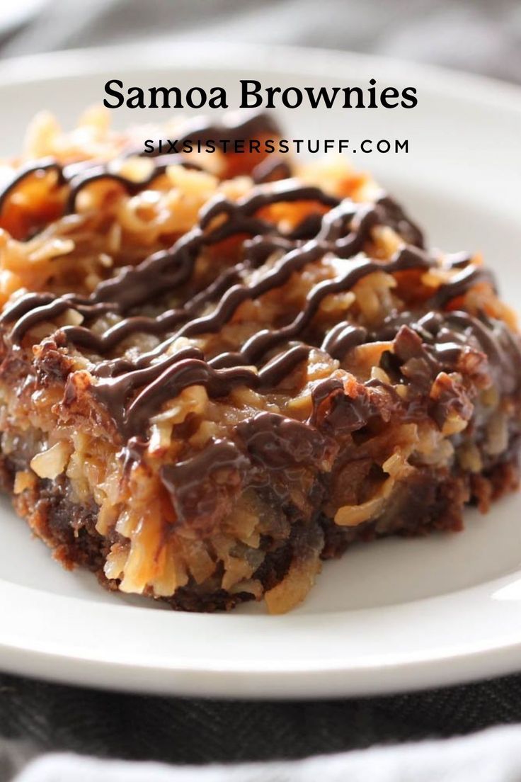 some kind of dessert on a white plate with chocolate drizzled over it