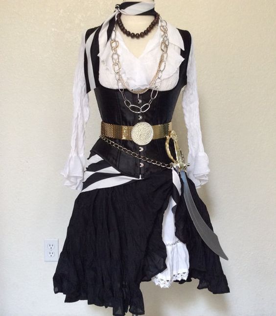 a black and white dress with chains on it