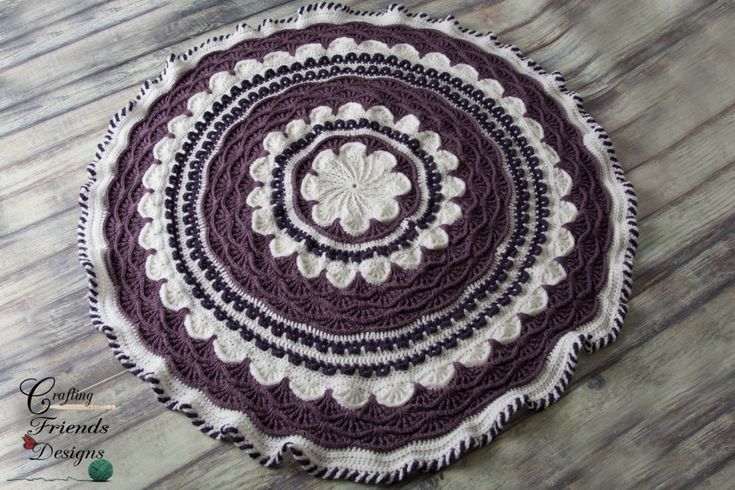 a crocheted doily on a wooden floor