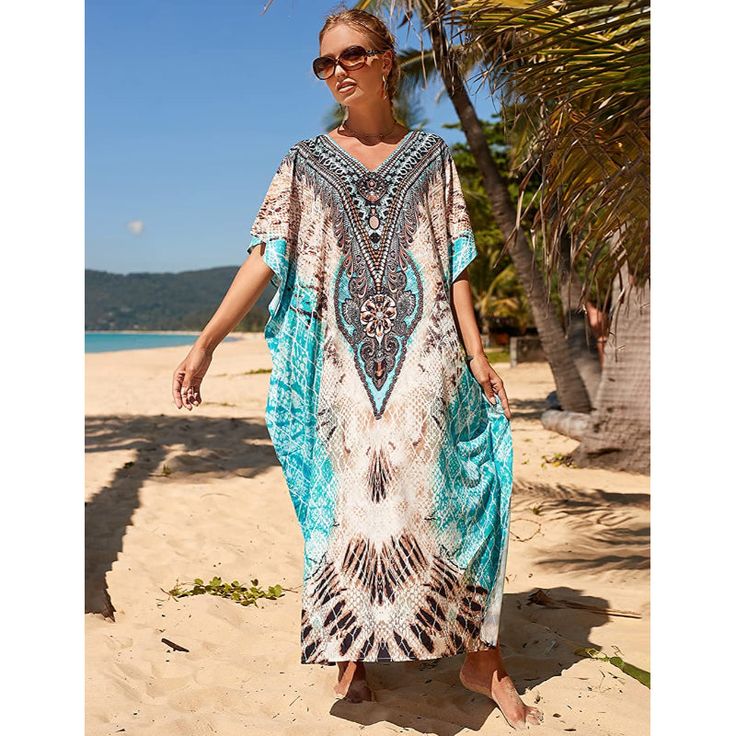 This Women's Suits Cover Up Beach Maxi Dress is a stunning piece that has been created using the beautiful hand-dying method of Indonesia. It will add a touch of style to your holiday wardrobe. The dress is versatile and can be worn during the day and night, as a gorgeous swimsuit cover-up at the beach, or as a glamorous evening dress. The wagging of the fabric creates a flattering and slimming silhouette and the dress is not too transparent. The open sides of the dress add a touch of sensuality Sarong Swimsuit Cover, Plus Size Beach Wear, Loose Summer Dress, Bohemian Summer Dresses, Plus Size Beach, Beachwear Collection, Beach Coverup Dress, Coverup Beach, Vestido Plus Size