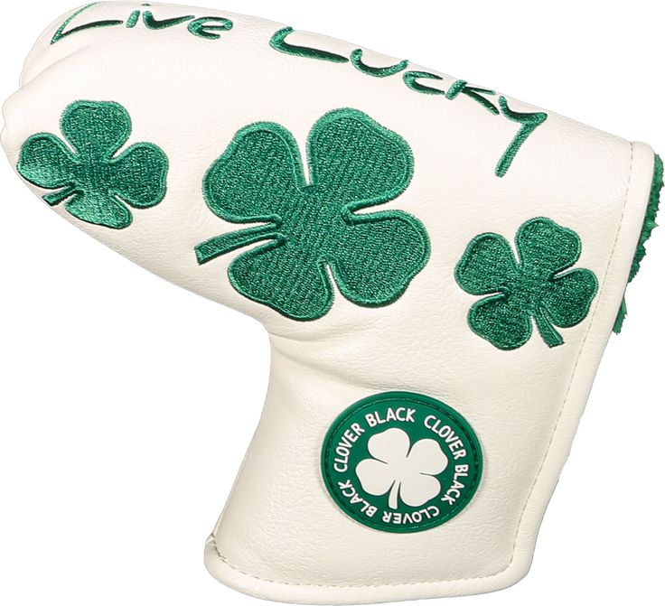 a close up of a white glove with shamrock clovers on the inside of it