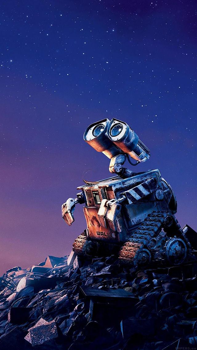 a robot sitting on top of a pile of rubble under a night sky with stars