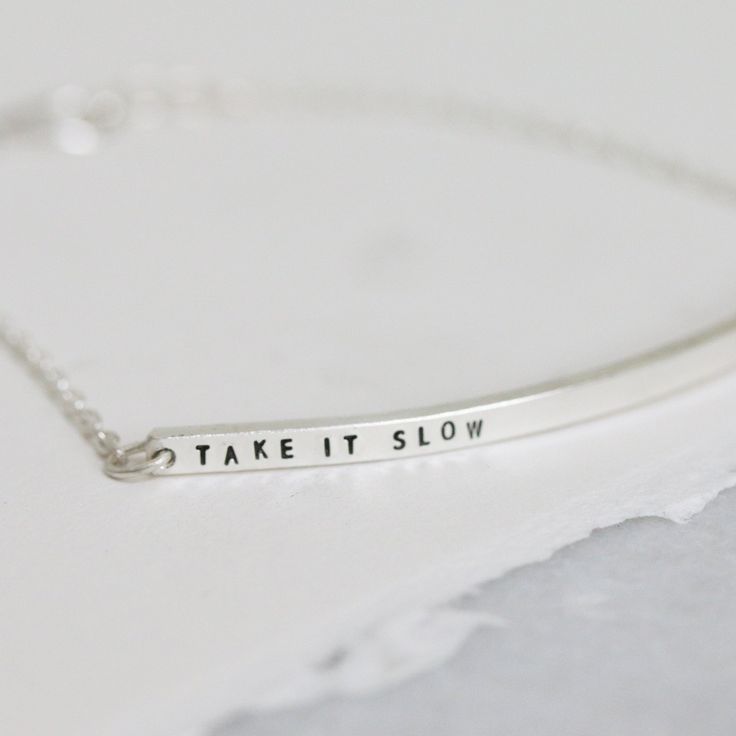 The ballet inspiracelet bracelet is a simple bar bracelet with a message in our signature teeny-tiny block font. Inspired by the long lines and fluid motion of ballet, this is bracelet is elegant and delicate. Add this bracelet to your everyday bracelet stack, or we love pairing it with our diamond dusted petite bangle. details+ bar measures approximately 2" long+ s hook closure+ handmade with love in our Georgia studio availability handmade to order. ships in 5 - 14 days.current production time Minimalist Sterling Silver Name Bracelet, Minimalist Hand Stamped Bracelets For Everyday, Minimalist Personalized Name Bracelet For Everyday, Minimalist Everyday Name Bracelet, Minimalist Personalized Name Bracelet, Sterling Silver Hand Stamped Name Bracelet For Everyday, Hand Stamped Sterling Silver Name Bracelet For Everyday, Minimalist Hand Stamped Sterling Silver Bracelets, Block Fonts