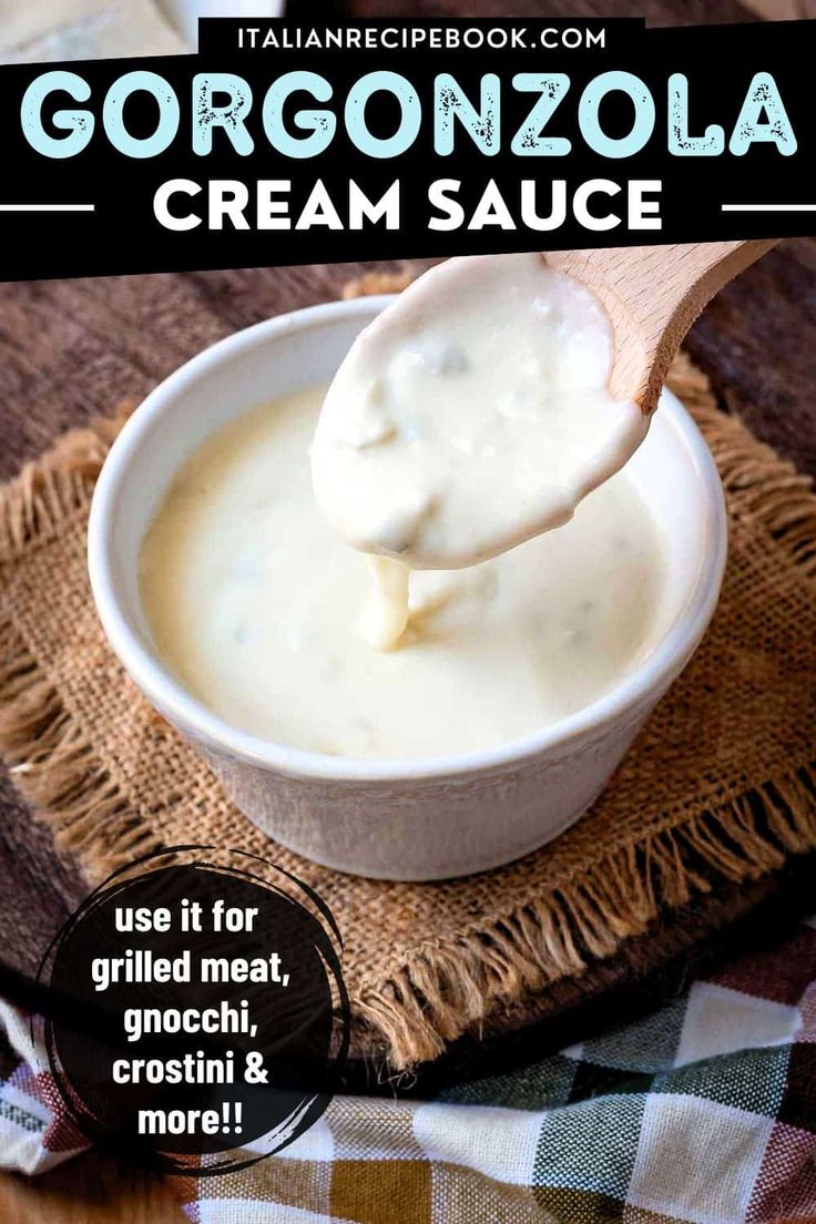 a spoon full of cream sauce sitting on top of a cloth