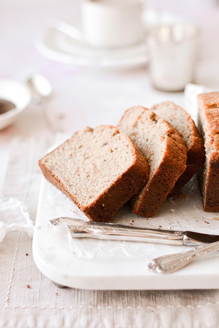 slices of banana bread on a plate with silverware