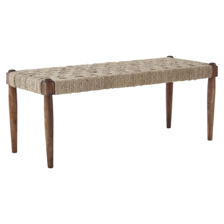 a wooden bench with woven seat and legs