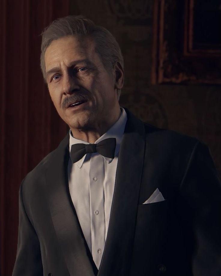 an older man wearing a tuxedo and bow tie in a dark room with wood paneling