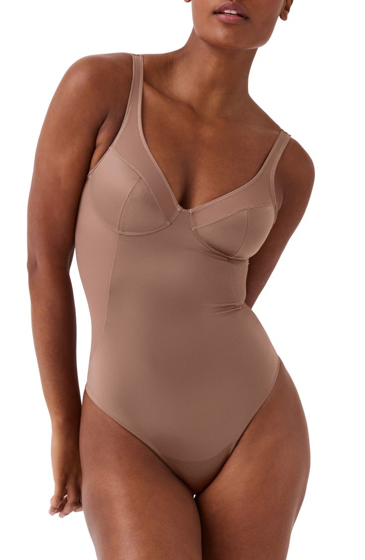 Smooth your silhouette with a shaping bodysuit that eliminates visible panty lines. Unlined cups provide light support to complete the foundational look. Medium compression Cotton-lined gusset 72% nylon, 28% elastane with 65% nylon, 35% Lycra® Xtra Life™ elastane contrast Machine wash, dry flat Imported Beige Smoothing Sculpting Bodysuit, Beige Sculpting Smoothing Bodysuit, Full Coverage Shapewear Bodysuit In Beige, Solid Contoured Full Coverage Bodysuit, Beige Full Coverage Shapewear Bodysuit, Elegant Shaping Bodysuit In Beige, Fitted Shapewear With Built-in Cups, Elegant Shaping Beige Bodysuit, Elegant Beige Shaping Bodysuit