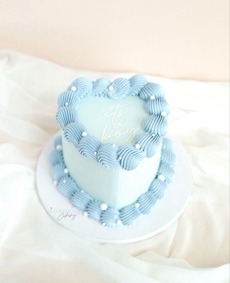 Heart cake, blue, it’s a boy lettering Baby Sprinkle Cake Boy, Blue Cakes For Boys, Heart Baby Shower Cake, Baby Blue Birthday Cake, Small Baby Shower Cake, Baby Blue Heart Cake, Heart Cake Blue And White, Simple Heart Cake, Light Blue Birthday Cake